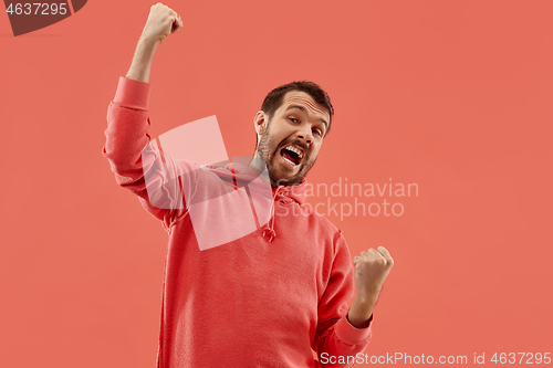 Image of Winning success man happy ecstatic celebrating being a winner. Dynamic energetic image of male model