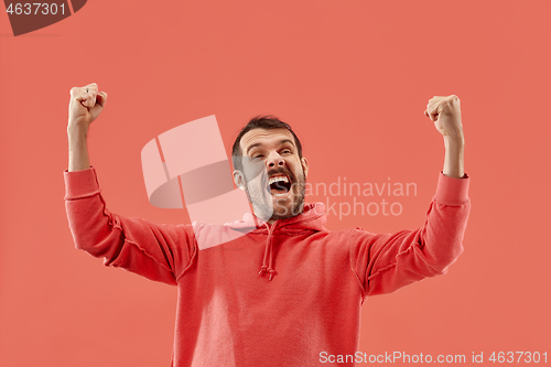 Image of Winning success man happy ecstatic celebrating being a winner. Dynamic energetic image of male model