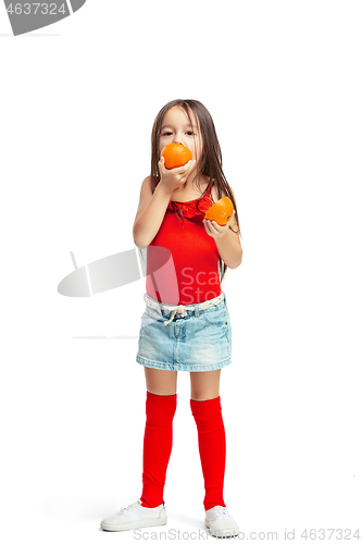 Image of Full length portrait of cute little kid in stylish jeans clothes with orange