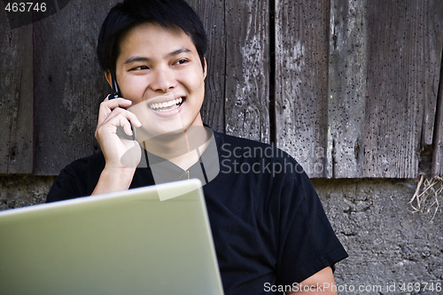 Image of Asian student on the phone