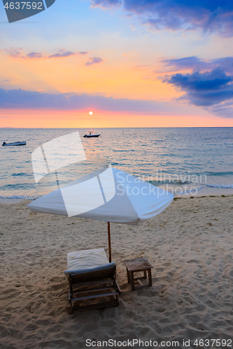 Image of Sunset over Madagascar Nosy be beach with sunlounger