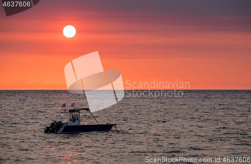 Image of Sunset over Madagascar Nosy be beach with boat silhouette
