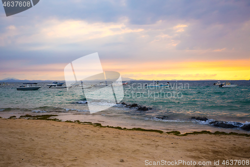 Image of Sunset over Madagascar Nosy be beach with boat silhouettes