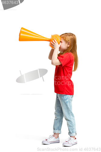 Image of Full length portrait of cute little kid in stylish jeans clothes looking at toy binoculars