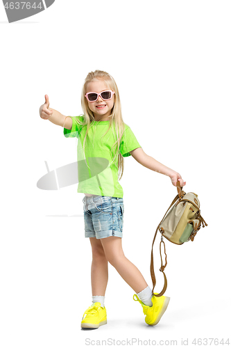 Image of Full length portrait of cute little kid in stylish jeans clothes looking at camera and smiling