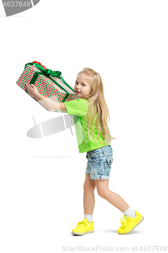 Image of Full length portrait of cute little kid in stylish jeans clothes looking at camera and smiling