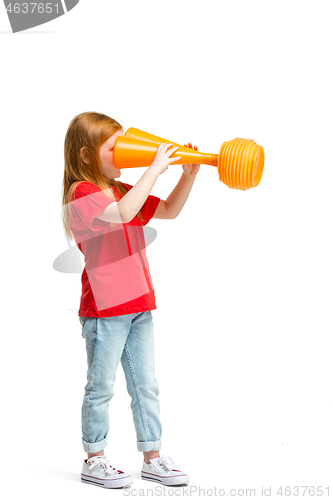 Image of Full length portrait of cute little kid in stylish jeans clothes looking at toy binoculars