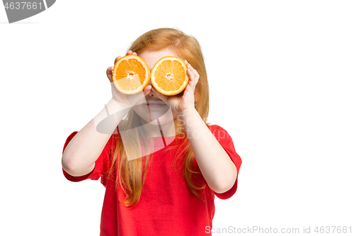 Image of Full length portrait of cute little kid in stylish jeans clothes with orange
