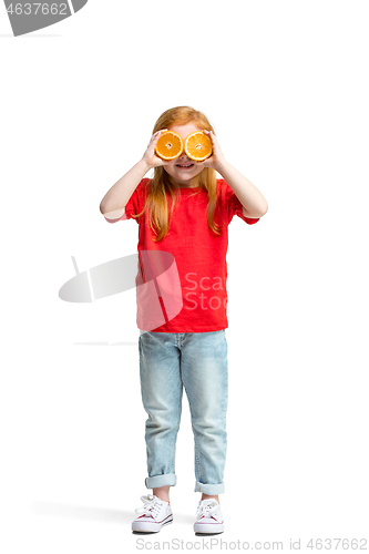 Image of Full length portrait of cute little kid in stylish jeans clothes with orange