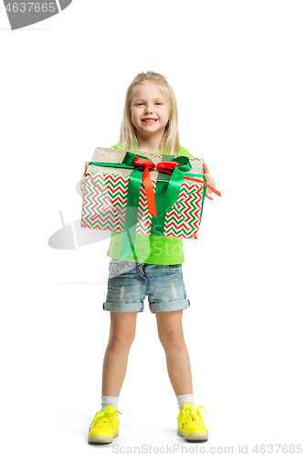 Image of Full length portrait of cute little kid in stylish jeans clothes looking at camera and smiling