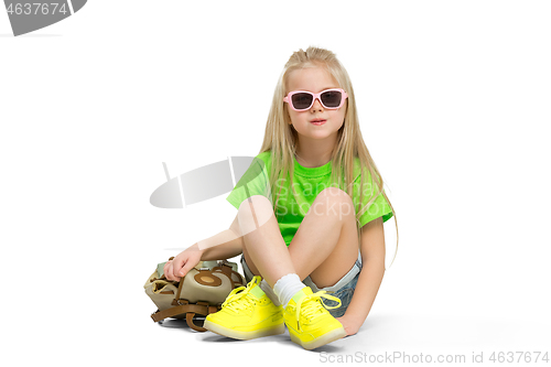Image of Full length portrait of cute little kid in stylish jeans clothes looking at camera and smiling