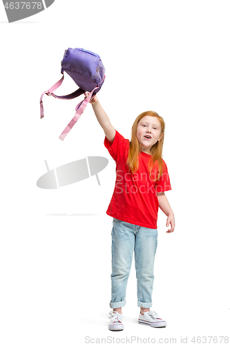 Image of Full length portrait of cute little kid in stylish jeans clothes looking at camera and smiling