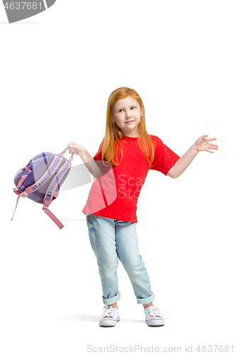 Image of Full length portrait of cute little kid in stylish jeans clothes looking at camera and smiling