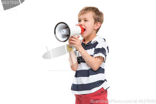 Image of Little cute kid baby boy holding in hand and speaking in electronic gray megaphone