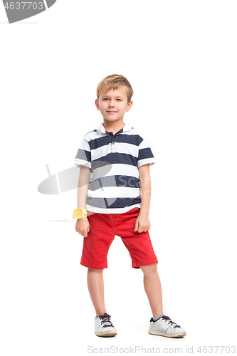 Image of Full length portrait of cute little kid in stylish clothes looking at camera and smiling