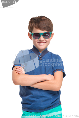 Image of Full length portrait of cute little kid in stylish clothes looking at camera and smiling