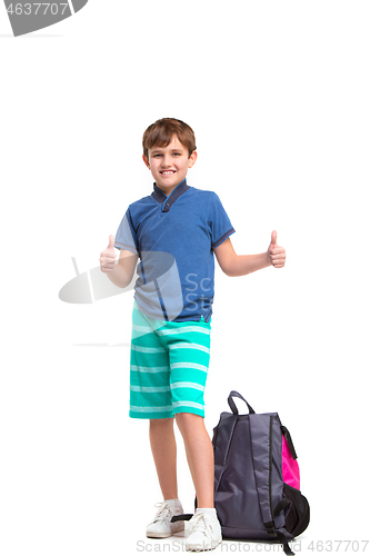 Image of Full length portrait of cute little kid in stylish clothes looking at camera and smiling