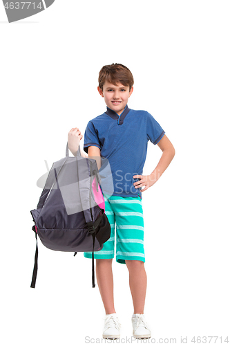 Image of Full length portrait of cute little kid in stylish clothes looking at camera and smiling