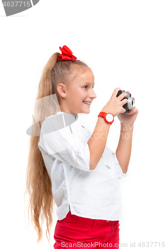 Image of Full length portrait of cute little kid in stylish clothes with retro camera