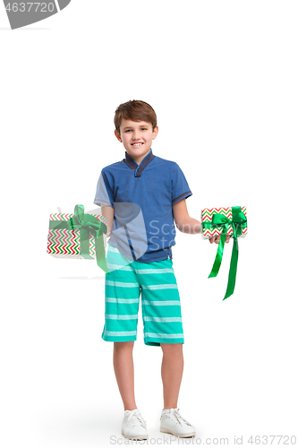 Image of Full length portrait of cute little kid in stylish clothes looking at camera and smiling