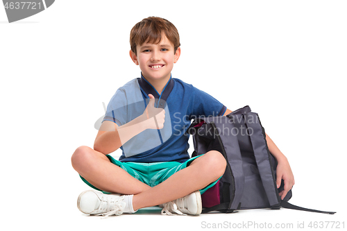 Image of Full length portrait of cute little kid in stylish clothes looking at camera and smiling