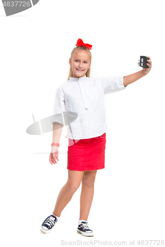 Image of Full length portrait of cute little kid in stylish clothes with retro camera