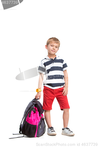 Image of Full length portrait of cute little kid in stylish clothes looking at camera and smiling