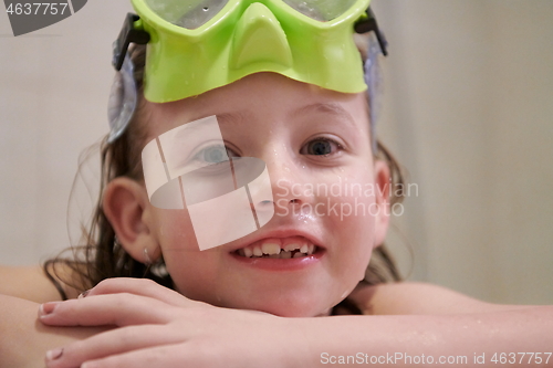 Image of little girl with snorkel goggles