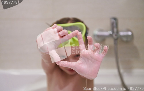 Image of little girl with snorkel goggles