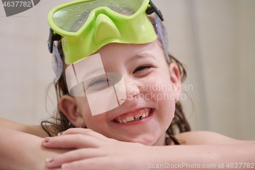 Image of little girl with snorkel goggles