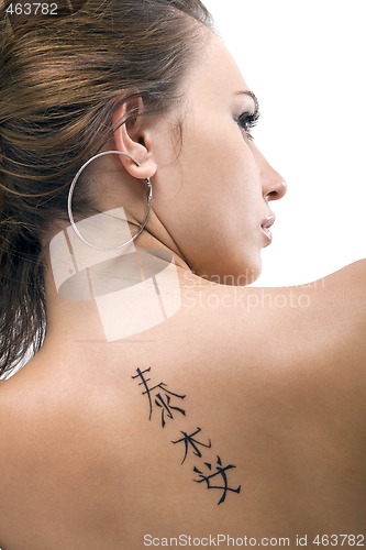 Image of Tattoo on a back of the young woman. Isolated 3