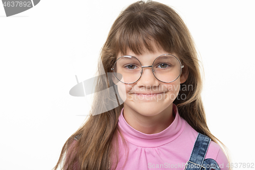 Image of Portrait of a natural beautiful girl in glasses on a white background