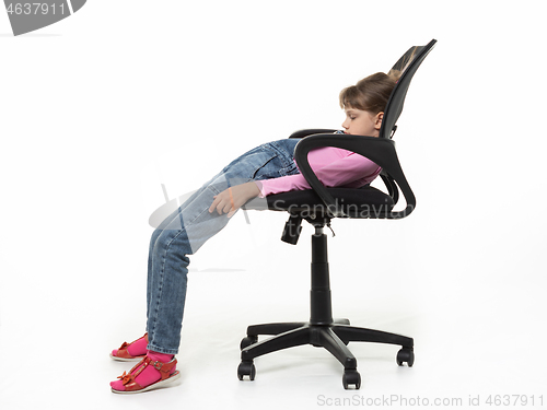 Image of Girl ten years old funny got off the office chair