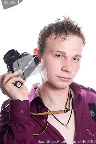 Image of The young man with old camera. Isolated on white