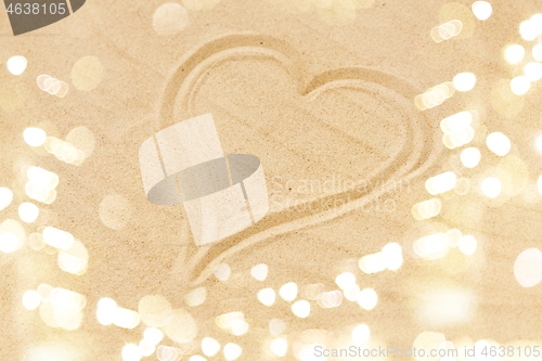 Image of picture of heart in sand on summer beach