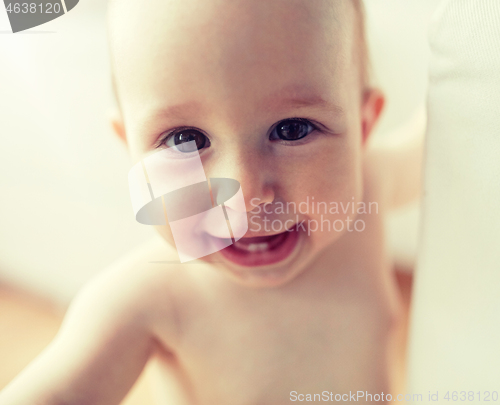 Image of close up of happy little baby boy or girl at home