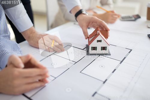 Image of close up of architects discussing house project