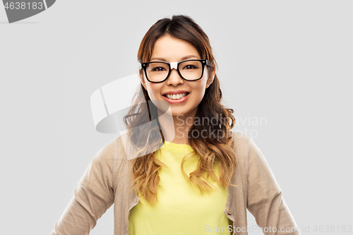 Image of happy asian woman in glasses or student