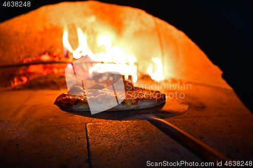 Image of rustic pizza in wood fired oven