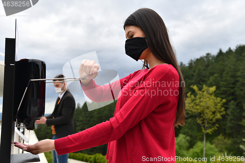 Image of hands disinfection in restaurant