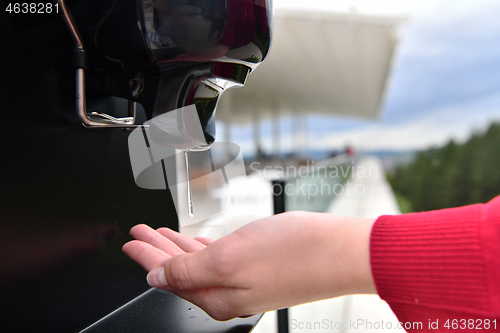 Image of hands disinfection in restaurant