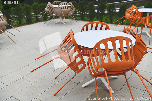 Image of restaurant tables and chairs at outdoor sitting at restaurant  d