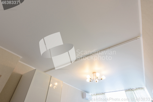 Image of Classic white matte stretch ceiling with separation for curtains in two halves