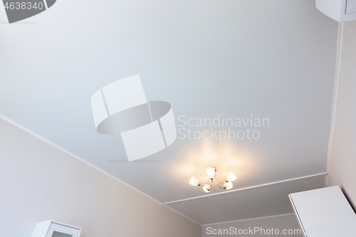 Image of Classic white matte stretch ceiling in the interior of the bedroom