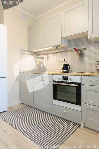 Image of Interior of a modern kitchen with built-in appliances