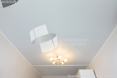 Image of Classic white matte stretch ceiling in the interior of the room