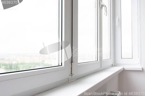 Image of Plastic window sill on a balcony glazed with plastic windows