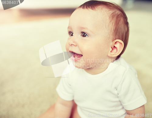 Image of close up of happy little baby boy or girl at home