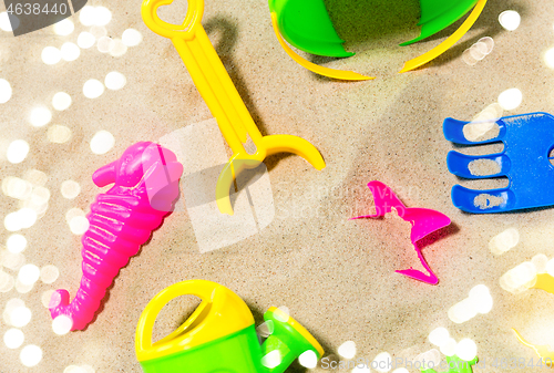 Image of close up of sand toys kit on summer beach