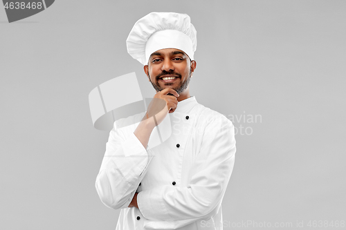 Image of happy male indian chef in toque